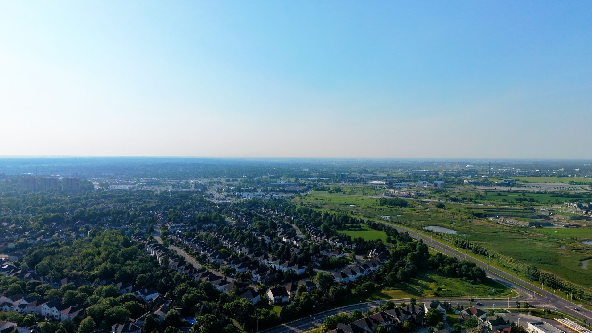 Aerial view of a leafy Northern Ohio suburban neighborhood on a clear morning